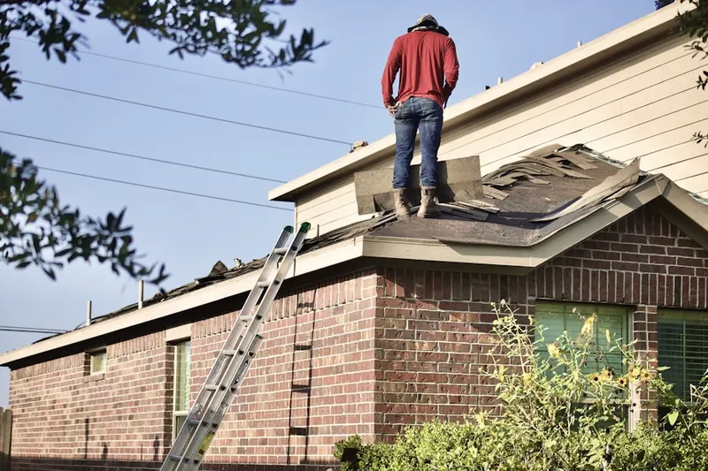 Professional roofer working on a residential roof in Westchase